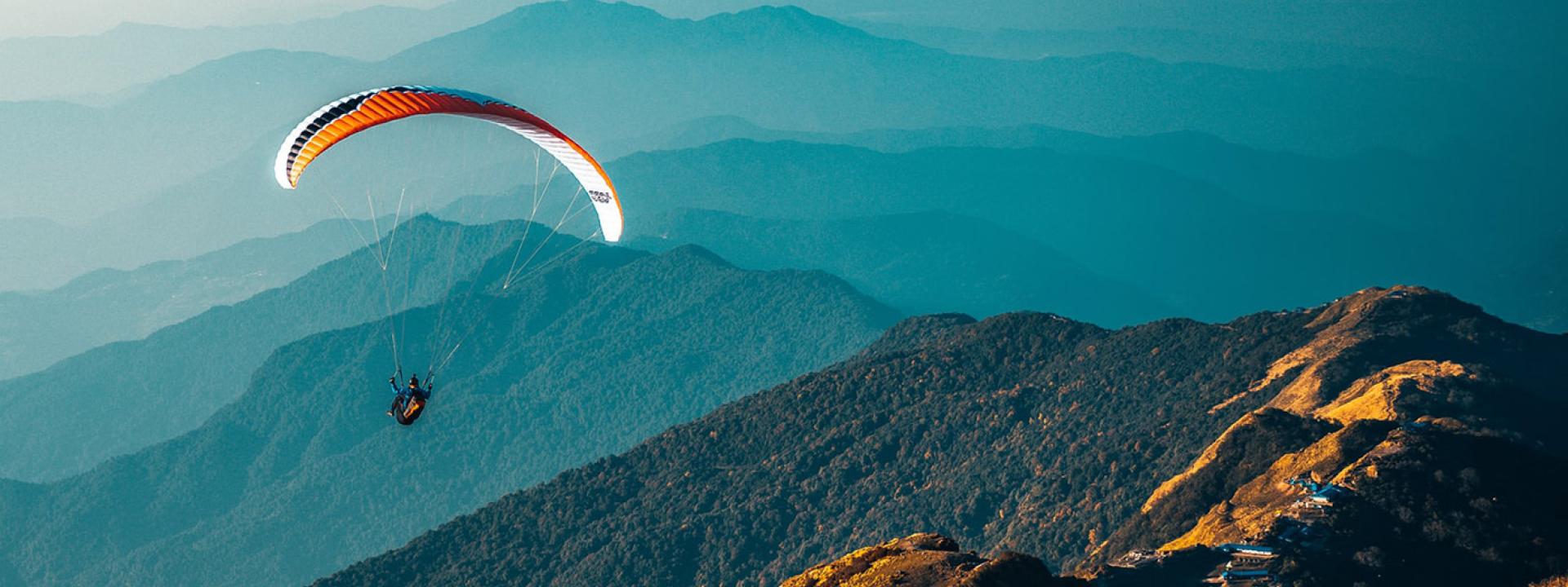 Parachute flly Parachute flying over mountains